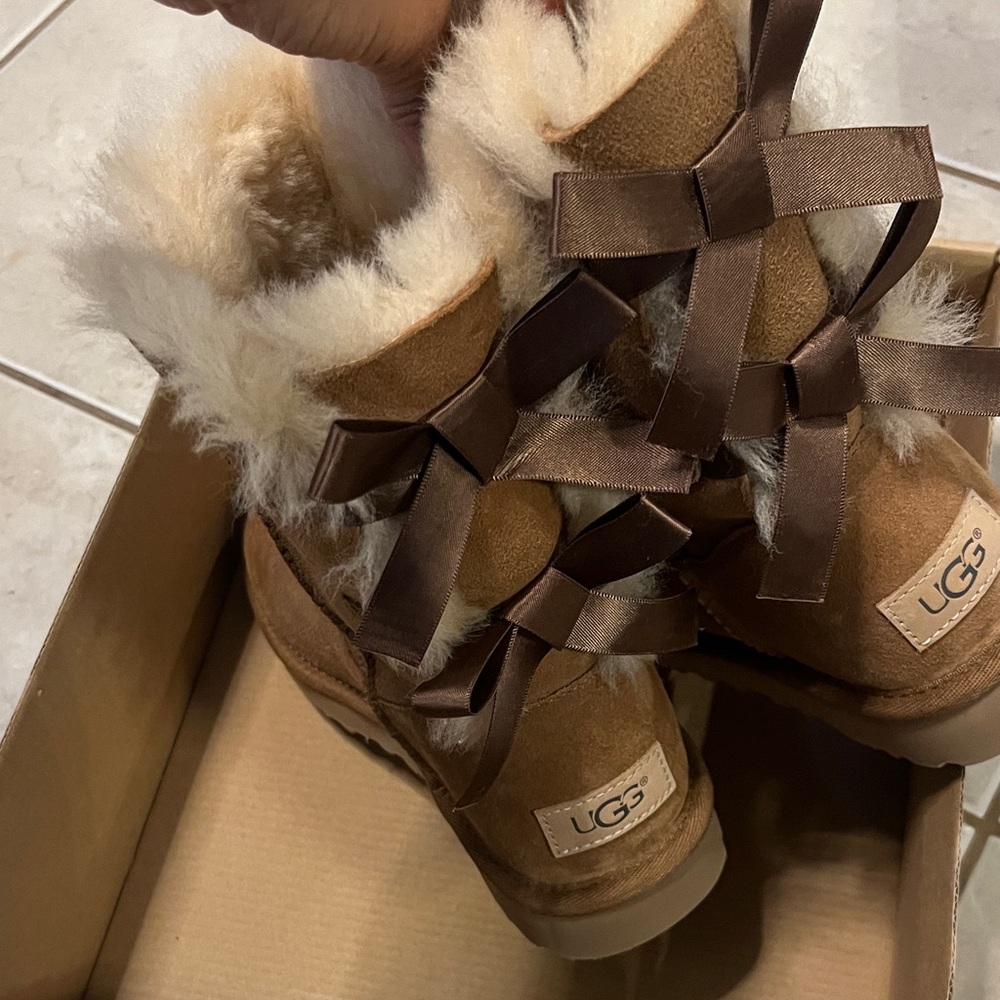 UGG Tan Shearling Boots with Brown Ribbon